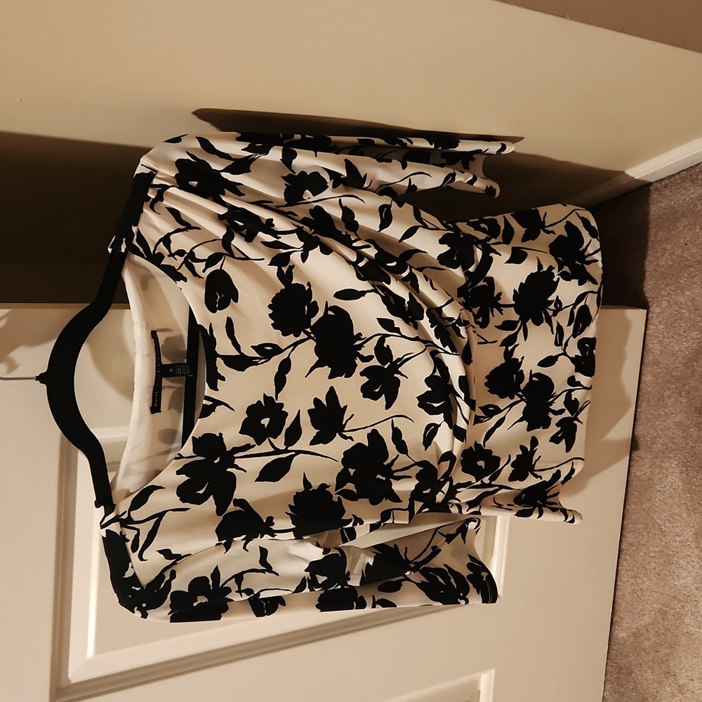 White and black floral blouse, size small.